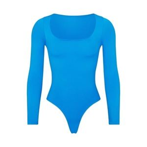 Skims Essential Long Sleeve Scoop Neck Bodysuit in Limited Edition Mykonos color